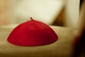 A cardinal's zucchetto, or skull cap, sits on a chair during an ordination Mass at St. Peter's Basilica. (CNS/Reuters/Paolo Cocco)