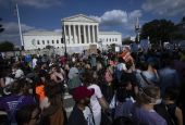 Abortion demonstrators are seen near the Supreme Court in Washington June 24 as the court overruled the landmark Roe v. Wade abortion decision in its ruling in the Dobbs case on a Mississippi law banning most abortions after 15 weeks. (CNS/Tyler Orsburn)