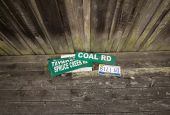 Road signs rest on the side porch of a house near Kermit, West Virginia, Aug. 20, 2014. The Supreme Court ruled in West Virginia v. Environmental Protection Agency on June 30, 2022, to limit EPA's ability to regulate carbon emissions from power plants.