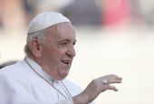 Pope Francis greets the crowd as he arrives for his general audience in St. Peter's Square at the Vatican Sept. 7. (CNS/Paul Haring)