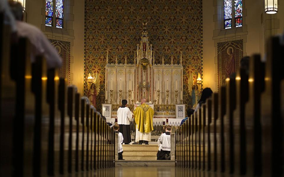 Fr. Stephen Saffron, parish administrator, prays during a traditional Latin Mass July 18 at St. Josaphat Church in the Queens borough of New York City. (CNS/Gregory A. Shemitz)