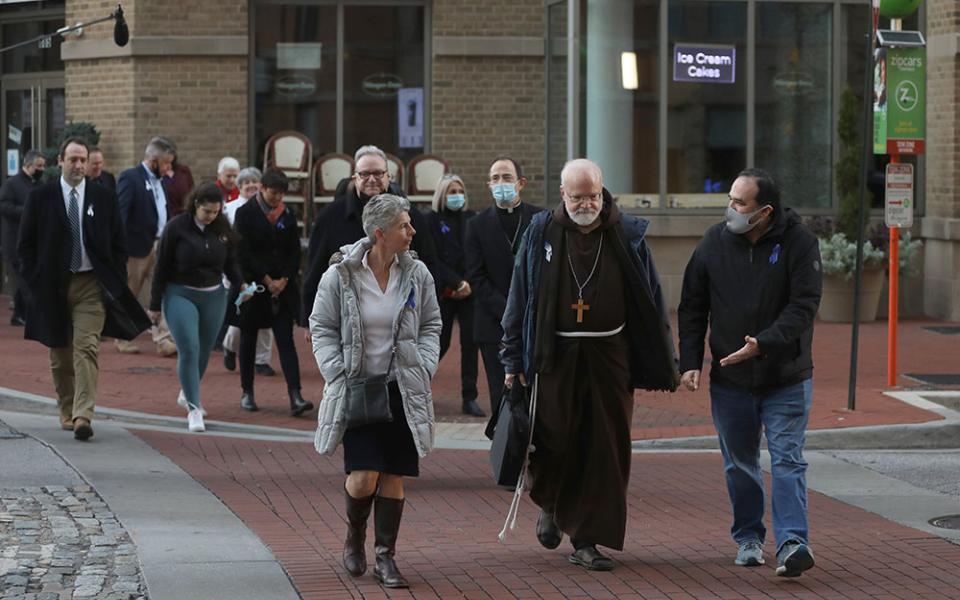 Cardinal Sean O'Malley of Boston, president of the Pontifical Commission for the Protection of Minors, joins a sunrise walk to end abuse Nov. 18 in Baltimore. (CNS/Bob Roller)