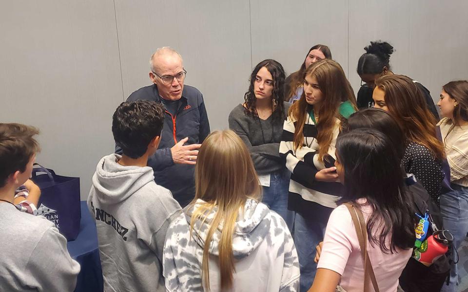 Environmental activist and writer Bill McKibben talks with attendees after a breakout session at the 25th annual Ignatian Family Teach-In for Justice on Oct. 22 in Washington, D.C. (EarthBeat photo/Brian Roewe)