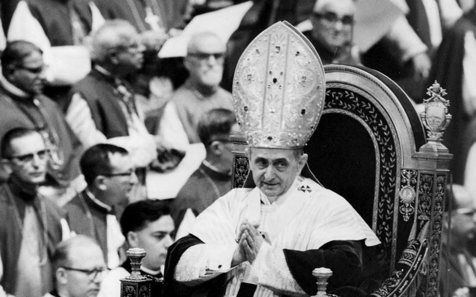 Pope Paul VI makes his way past bishops during a session of the Second Vatican Council in 1964.