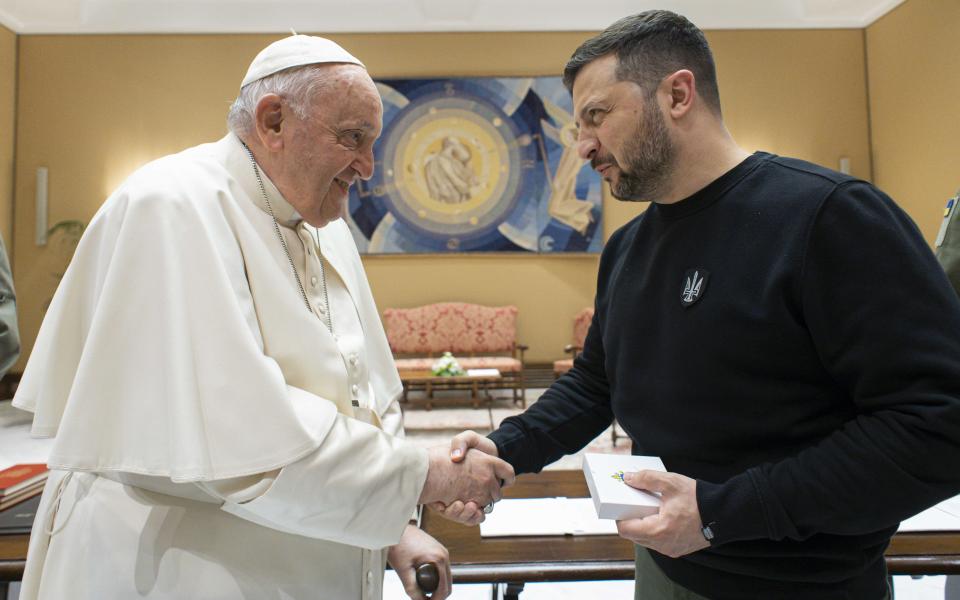 Pope Francis and Ukrainian President Volodymyr Zelenskyy shake hands after their meeting at the Vatican May 13, 2023. (CNS photo/Vatican Media)