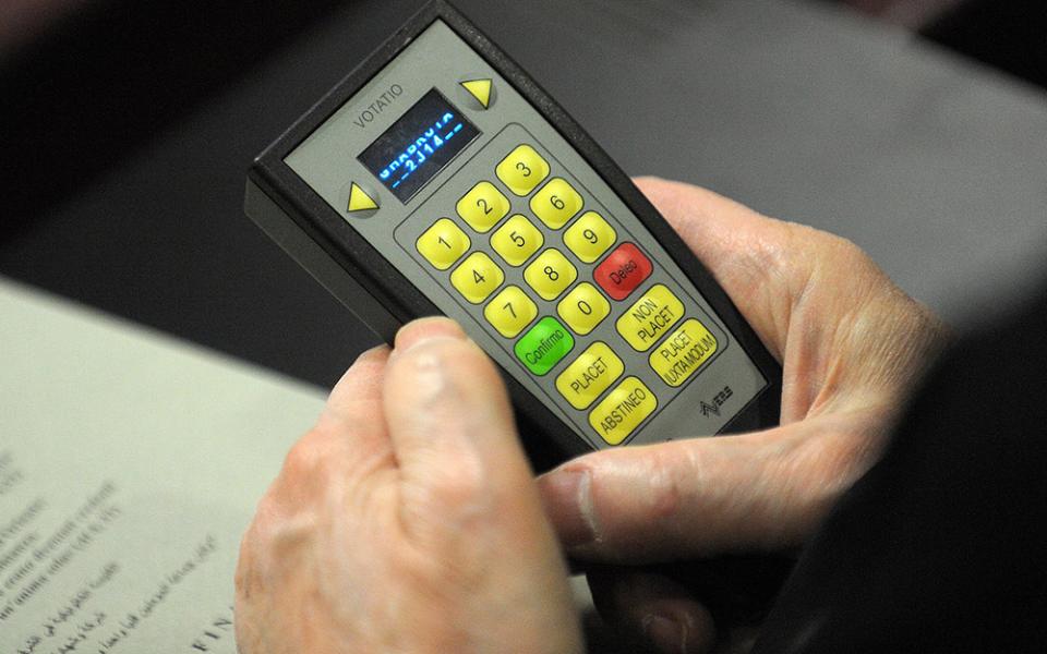 An electronic voting device is used by a participant during the Synod of Bishops for the Middle East at the Vatican in 2010. (CNS/Catholic Press Photo/Alessia Giuliani)