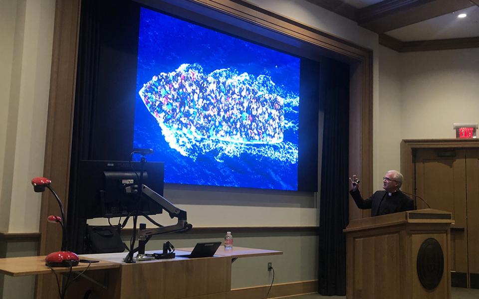 Holy Cross Fr. Dan Groody, an expert on migration and refugees, gives a talk at the University of Portland June 12. To inform his understanding of migration, Groody has traveled to some 50 countries and spoken to migrants, Border Patrol agents, nurses, politicians and bishops. (NCR photo/Katie Collins Scott)