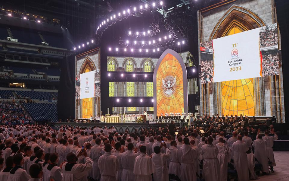 Bishop Andrew Cozzens of Crookston, Minnesota, announces July 21 — the final day of the National Eucharistic Congress at Lucas Oil Stadium in Indianapolis — that a Eucharistic pilgrimage from Indianapolis to Los Angeles is being planned for spring 2025. Congress organizers were also considering holding an 11th National Eucharistic Congress in 2033. (OSV News/Bob Roller)