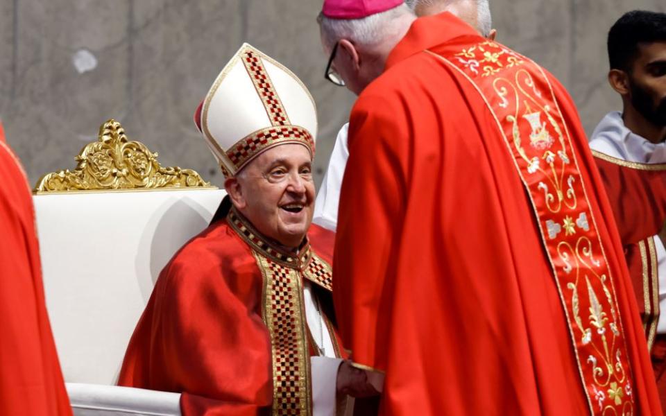 Pope Francis gives the pallium to Archbishop Christopher Coyne of Hartford, Connecticut, during Mass for the feast of Sts. Peter and Paul in St. Peter's Basilica at the Vatican June 29, 2024. 