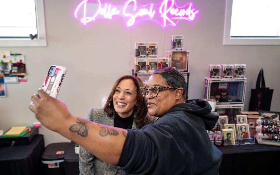 Vice President Kamala Harris poses for a photo with Della Marie Levi, owner of Della Soul Records, the first Black woman-owned vinyl record store in Grand Rapids, Michigan, Feb. 22. 