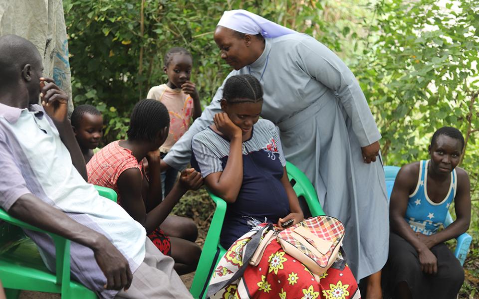  Sr. Celestine Nelima of the Sisters of Mary of Kakamega, interacts with flood victims in the Khumwanda displacement camp in Busia, a town in western Kenya, on July 17. Religious sisters have supported homeless individuals by offering shelter, food, clothing, education, medical assistance, and spiritual guidance and counseling. (GSR photo/Doreen Ajiambo)