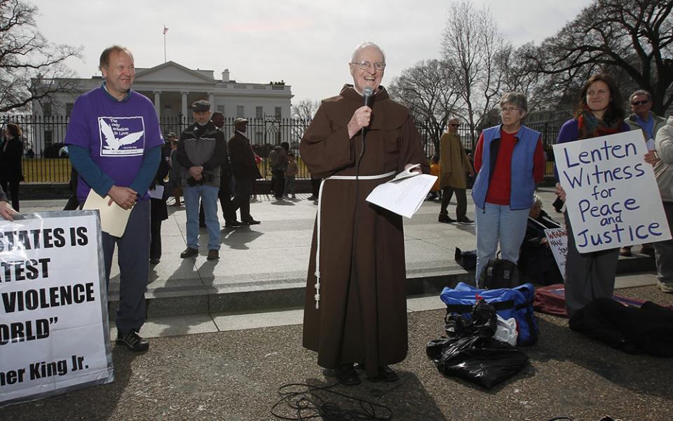 Franciscan Fr. Joseph Nangle, associate pastor of Our Lady Queen of Peace in Arlington, Va., speaks during a prayer service in front of the White House in Washington on Ash Wednesday, Feb. 22, 2012. (CNS/Peter Lockley)