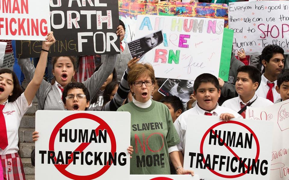 People are pictured in a file photo displaying signs in Los Angeles during the "Walk 4 Freedom" in advance of the Jan. 11, 2024, National Human Trafficking Awareness Day. January is Human Trafficking Awareness month in the U.S. (OSV News/CNS file, Vida Nueva, Victor Aleman)