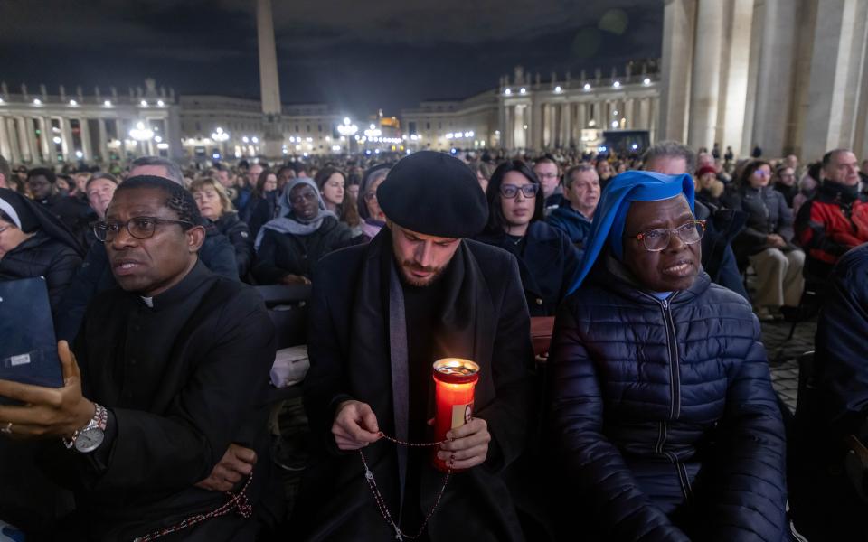  People join Cardinal Víctor Manuel Fernández, prefect of the Dicastery for the Doctrine of the Faith, for the recitation of the rosary for Pope Francis in St. Peter’s Square at the Vatican Feb. 28, 2025. Pope Francis has been hospitalized since Feb. 14 with double pneumonia. (CNS photo/Pablo Esparza)