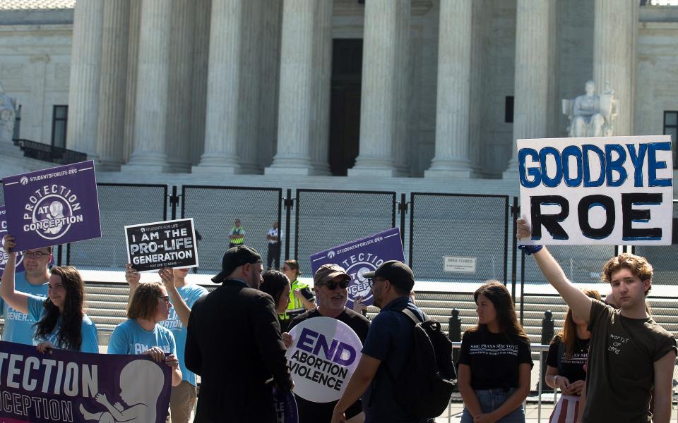 Pro-life demonstrators are seen near the U.S. Supreme Court in Washington June 15. The Supreme Court June 24 released an opinion that overturns Roe v. Wade after nearly 50 years. (CNS/Tyler Orsburn)