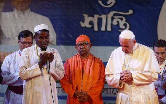 Pope Francis prays with religious leaders after meeting Rohingya refugees from Myanmar during an interreligious and ecumenical meeting for peace in the garden of the archbishop's residence in Dhaka, Bangladesh, Dec. 1. (CNS/Paul Haring)