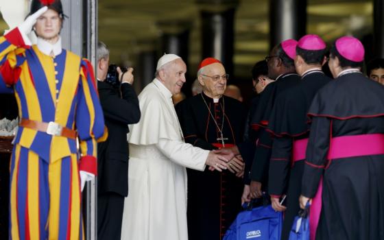 Pope Francis greets bishops as they arrive for a session of the Synod of Bishops on young people, the faith and vocational discernment at the Vatican Oct. 16. (CNS/Paul Haring)