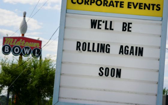 A message in Atlanta is seen on a sign outside the Midtown Bowl bowling alley April 21 days before the phased reopening of businesses and restaurants from coronavirus disease restrictions. (CNS/Reuters/Elijah Nouvelage)