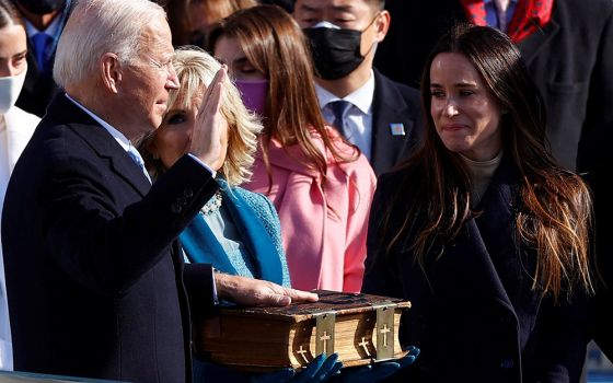 Joe Biden is sworn in as the 46th president of the United States by Chief Justice John Roberts as Biden's wife, Jill, holds the family Bible during his inauguration Jan. 20 at the Capitol in Washington. (CNS/Jim Bourg, Reuters)