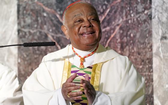 Washington Cardinal Wilton Gregory smiles and claps as a gospel choir named for Sr. Thea Bowman sings during a Black History Month Mass of thanksgiving Feb. 20 at Immaculate Conception Church in Jamaica Estates section of Queens, New York. (CNS)