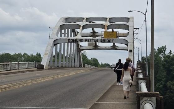 Graduate students in theology and ministry at Catholic Theological Union walk across the Edmund Pettus Bridge in Selma, Alabama, during a pilgrimage of sacred sites from the U.S. Civil Rights Movement. 