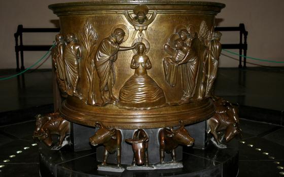 The Baptismal font of St. Bartholomew Church in Liège, Belgium, carries the imagery of golden calves forward. Twelve bulls support the basin, where Christ stands in the waters of the Jordan, the power of the Holy Spirit rushing upon him (1 Samuel 16:13). (Wikimedia Commons/Jean-Pol Grandmont, CC by 2.5)