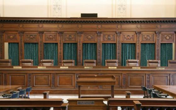 Paneled interior of courtroom.