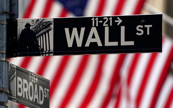 Wall Street sign is pictured outside the New York Stock Exchange April 16, 2021, in New York City. (OSV News/Reuters/Carlo Allegri)