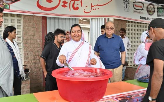 Franciscan Missionary of Christ the King Sr. Fazilat Inayat prepare chilled sharbet (a popular South Asian beverage) on July 12, the fifth of Muharram, at a stall outside Dar-ul-Sukun Centre in Karachi, Pakistan. The congregation distributed the drink as Muslims of the Dawoodi Bohra community observed Ashara Munaraka. (Courtesy of Kashif Anthony)