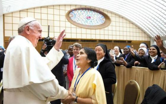 Pope Francis greets participants in a special audience with members of the International Union of Superiors General in the Paul VI hall at the Vatican May 12, 2016. Francis created a commission to study whether women can be deacons in the Catholic Church, but the reports were never made public. (Courtesy L'Osservatore Romano)