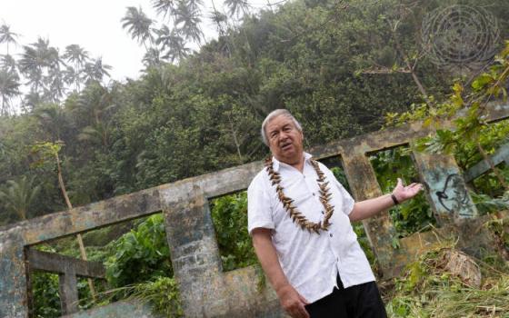 UN Secretary-General António Guterres visits an house that has been abandoned due to storm damage and flooding as a result of climate change during his trip to Samoa.(UN Photo/Kiara Worth)