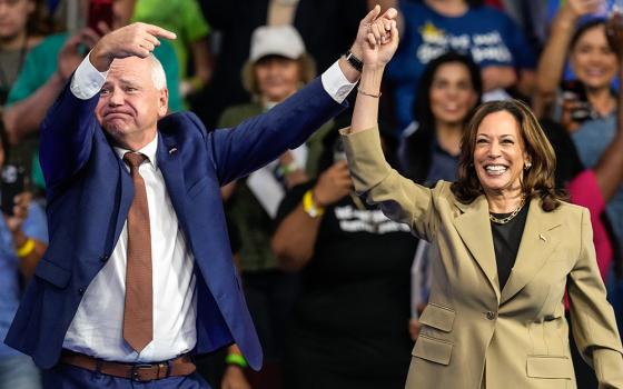 Democratic presidential nominee Vice President Kamala Harris and running mate Minnesota Gov. Tim Walz arrive at a campaign rally at Desert Diamond Arena Aug. 9 in Glendale, Arizona. (AP/Ross D. Franklin)