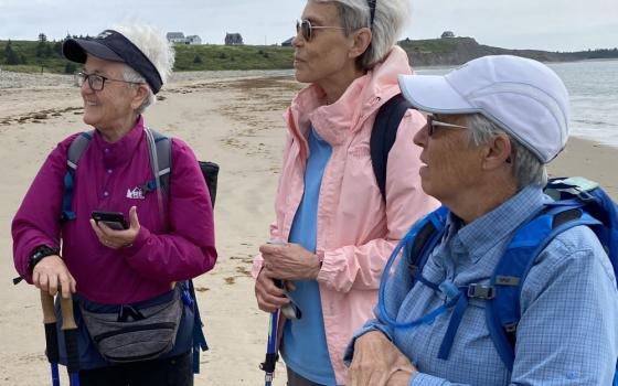 Religious of the Sacred Heart Sr. Mary Frohlich, center, is seen at Hirtle's Beach, Nova Scotia. She is with Sr. Diane Roche, left, and Sr. Jane O'Shaughnessy. Frolich is a hiking retreat leader and certified as a forest therapy guide. (Ellyn Stewart)