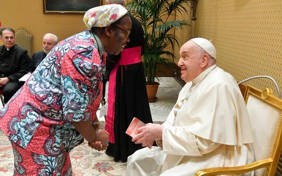 Pope Francis greets Congolese Sr. Josée Ngalula, a Sister of St. Andrew and one of five women theologians on the International Theological Commission, a body that studies theological questions for the Dicastery for the Doctrine of the Faith, Nov. 30, 2023, at the Vatican. (CNS/Vatican Media)