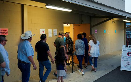 People stand in a line to vote shortly before the polls close in Edinburg, Texas, during the Super Tuesday primary election March 5, 2024. (OSV News/Reuters/Cheney Orr)