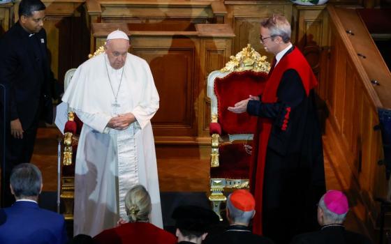 Pope Francis is welcomed to the Catholic University of Leuven in the city of Leuven, Belgium, Sept. 27, by Luc Sels, rector and vice-chancellor. Founded in 1425 with a decree by Pope Martin V, Leuven is the oldest Catholic university in the world. (CNS/Lola Gomez)