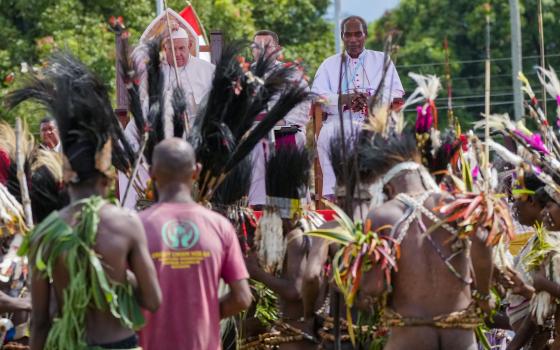 Pope Francis, with the Bishop of Vanimo Francis Meli, right, attends a meeting with faithful in Vanimo, Papua New Guinea, Sunday, Sept. 8, 2024. Pope Francis celebrated the Catholic Church of the peripheries on Sunday as he traveled to the remote jungles of Papua New Guinea, bringing with him a ton of medicine and toys and a message of love overcoming violence for the people who live there.(AP Photo/Gregorio Borgia)