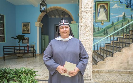 Sr. María Ángel Díaz Ledesma in the hallway of Casa Santa Brigida in Havana. Behind her is a portrait of the founder of the Order of the Most Holy Savior of St. Bridget, St. Mary Elizabeth Hesselblad. (Joanna Kozakiewicz) 