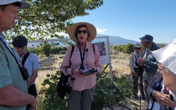 Sr. Barbara Reid, president of Catholic Theological Union and a Dominican of Grand Rapids, Michigan, talks to participants during a biblical study tour of Greece and Turkey, "In the Footsteps of St.Paul." Here she is near the entrance to the  archeological site of ancient Philippi, where she explains how St. Paul honors many women who were leaders in the Early Christian communities. (GSR photo/Gail DeGeorge)