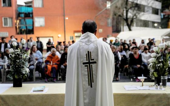 A priest celebrates Mass in Mexico City Jan. 11, 2018. (OSV News/Reuters/Carlos Jasso) 