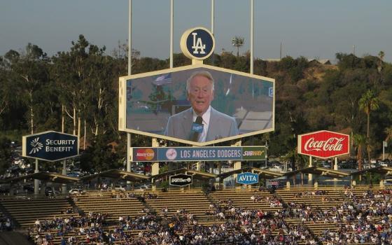 Longtime LA Dodgers announcer Vin Scully appears on a screen June 26, 2014, as the Dodgers took on the St. Louis Cardinals at Dodger Stadium. Scully is the focus of "Perfect Eloquence," a new collection of essays. (Wikimedia Commons/CC-BY-SA-2.0/Ken Lund)