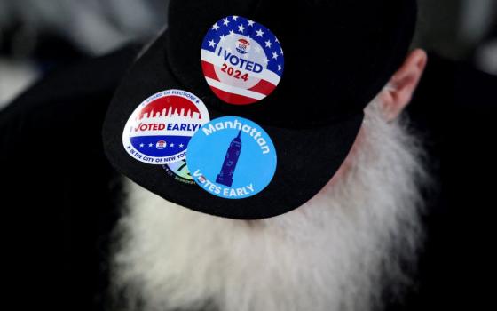 A man wears a hat with stickers on Election Day, Nov. 5, for the U.S. presidential election in the Manhattan borough of New York City. 