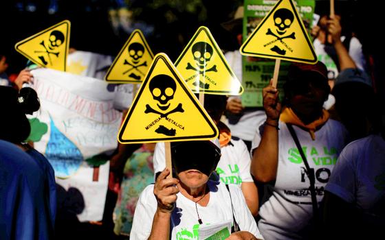 Protesters march against metal mining in a demonstration convened by the Catholic Church March 9, 2017, in San Salvador, El Salvador. (CNS/Reuters/Jose Cabezas)