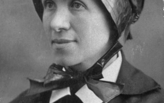 Black and white portrait of the sister in bonnet. 