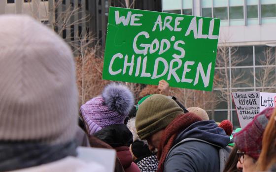 A participant holds a sign during a Jan. 25, 2025, interfaith rally in support of immigrants at Love Park in downtown Philadelphia. The event, organized by nonprofit New Sanctuary Movement, challenged city officials to push back on Trump administration policies that restrict immigration and include plans for mass deportations of unauthorized immigrants. (OSV News/Gina Christian)