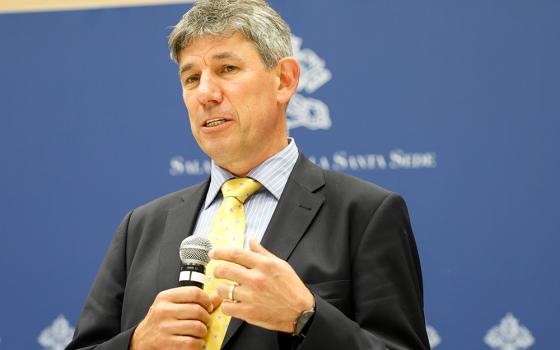 Alistair Dutton, then-new secretary-general of Caritas Internationalis, speaks to reporters during a news conference at the Vatican press office May 16, 2023. (CNS/Lola Gomez)