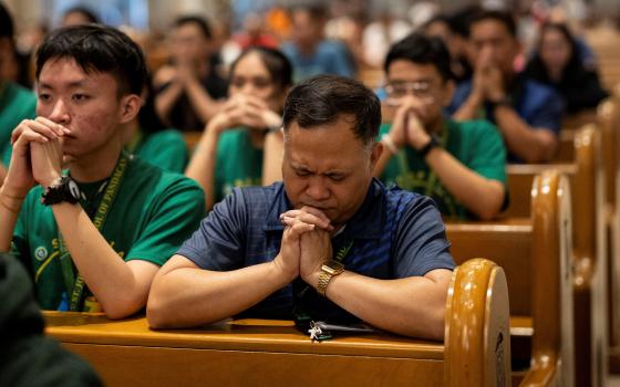 Filipino Catholics attend a Holy Hour to pray for Pope Francis' health, at the Manila Cathedral Feb. 21, 2025.