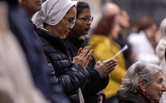 People pray for the ailing Pope Francis during a special evening Mass Feb. 23, 2025, in Rome's Basilica of St. John Lateran. (CNS/Pablo Esparza)