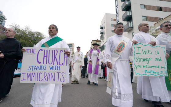 Following a prayer service for migrants in San Diego, California, participants march from the city's Catholic cathedral to the Federal Building (Chris Stone)