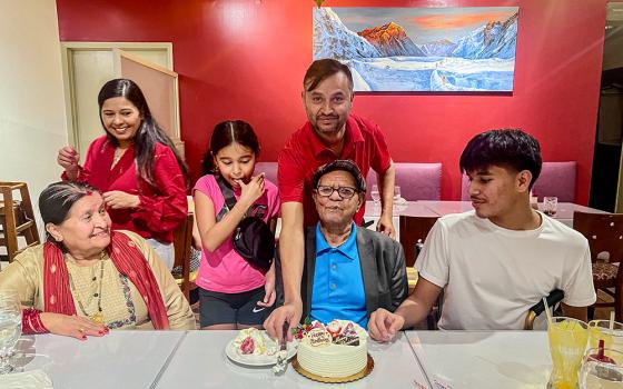 Leela Kuikel celebrates his father's birthday with his mother, his wife and their children. (Courtesy of Leela Kuikel)